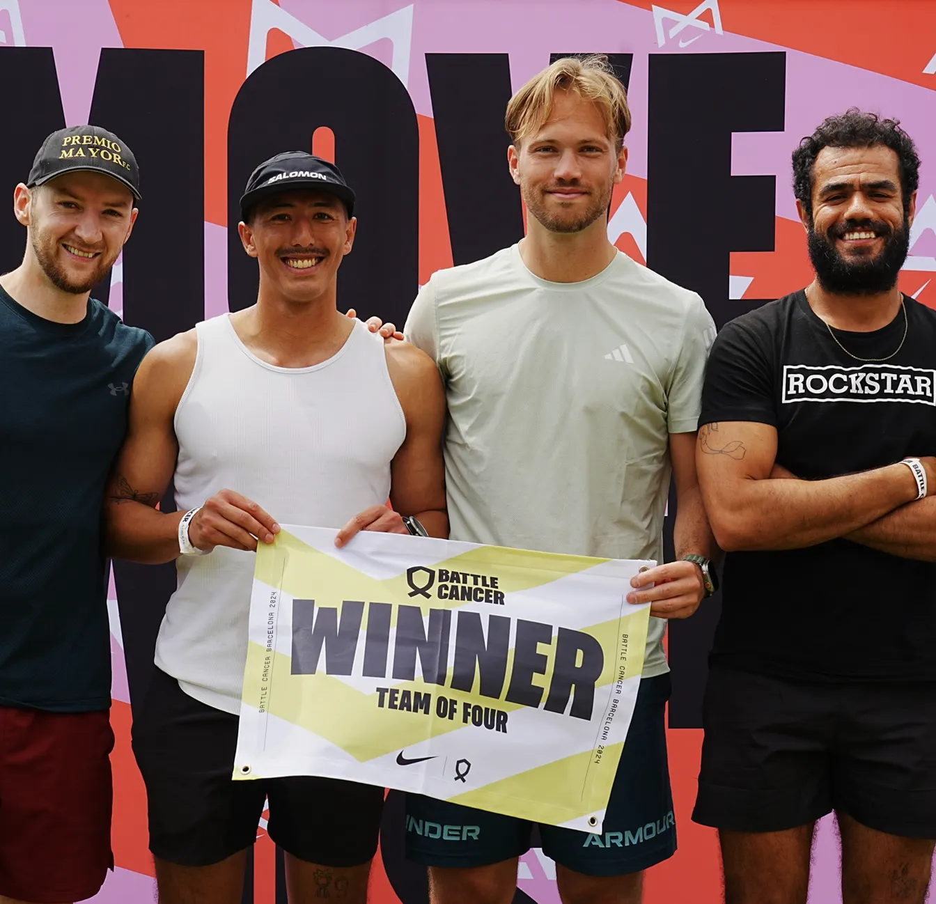 Group of 4 holding winner sign
